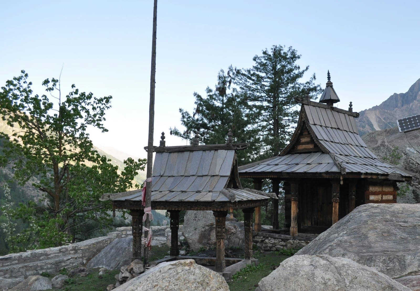 A traditional wooden Himachali temple among deodar trees